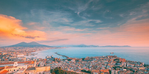Fototapeta na wymiar Naples, Italy. Skyline Cityscape City In Evening Sunset. Tyrrhenian Sea And Landscape With Volcano Vesuvius