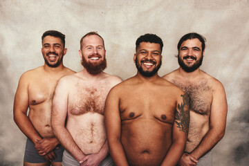 Fototapeta na wymiar Portrait of shirtless men smiling cheerfully
