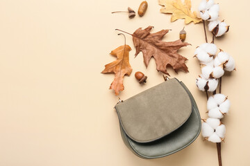 Autumn composition with cotton flowers and bag on beige background