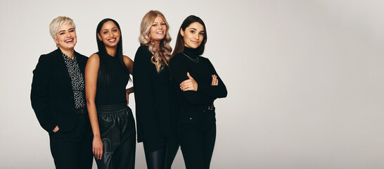 Diverse group of women smiling in a studio