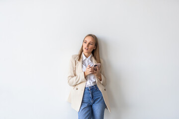 Young businesswoman use phone on white background