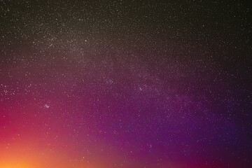 Night Sky Glowing Stars Background Backdrop. Colorful Sky Gradient. Sunset Sunrise Dawn Lights And Colourful Night Starry Sky In Yellow Pink Magenta Orange Purple Colors