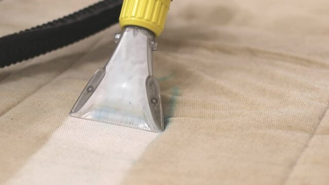 Close up footage of cleaning Sofa with vacuum cleaner and detergent, Before and after view