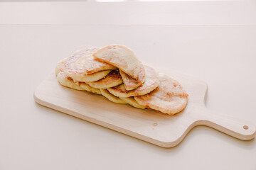 Korean winter food hotteok on a wooden plate.