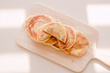 Korean winter food hotteok on a wooden plate.