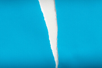 The texture of the torn blue paper.