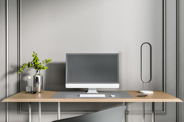 Close up of luxury designer desktop with empty black computer screen, keyboard, decorative plant and other items on concrete wall background. Workplace concept. Mock up, 3D Rendering.