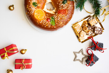 Spanish Christmas cake Roscon de reyes, Spanish cake ,gift boxes  on white background with...