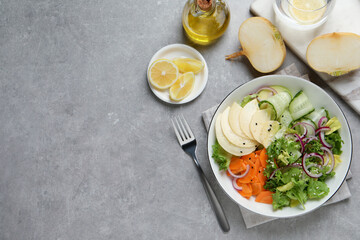 Fresh turnip salad served on grey table, flat lay. Space for text