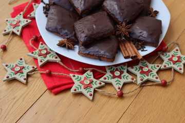 Italian traditional festive cookies called Mostaccioli or Mustaccioli on a plate on red napkin with...