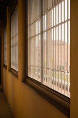 long corridor with windows and bars