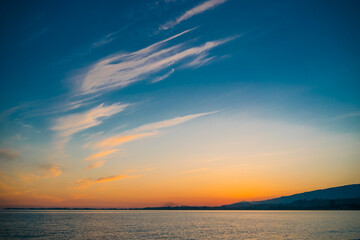 Obraz premium Sunset on the background of bright blue sky