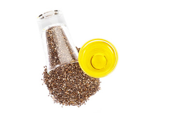 Close up organic sesame seeds and sesame oil in glass on white background. Health food concept.
