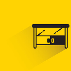 office table with shadown on yellow background