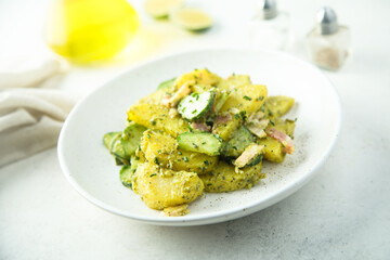 Homemade potato salad with pesto and bacon