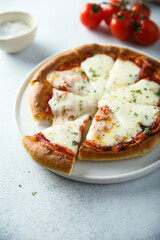 Homemade pizza with mozzarella and tomato sauce	