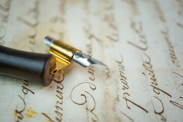 Old fashion writing sample with different writing techniques, papers, styles and calligraphy nibs.