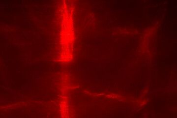 Abstract red lines drawn by light on a black background