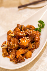 A delicious Chinese dish, pork ribs with sweet and sour orange