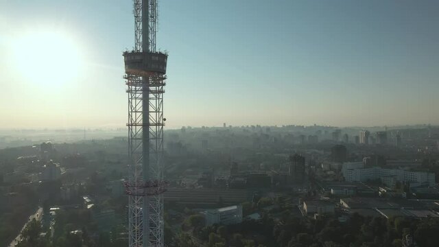 Satellite tower telecommunication antenna on sunset. Wireless communication station. Broadcast tower communication. Television station pylon. Broadcast transmitter building