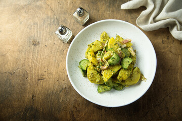 Homemade potato salad with pesto and bacon