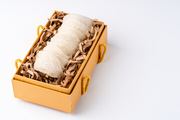 Top Grade edible bird nest shoot on white background with negative space. Raw edible bird's nest materials for tradition chinese medicine. Swallow nest the traditional chinese delicacy.
