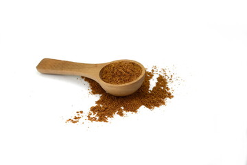 Garam Masala spice in a wooden spoon isolated on white background. Indian spice mix. 