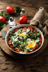 Traditional homemade shakshuka with fresh parsley