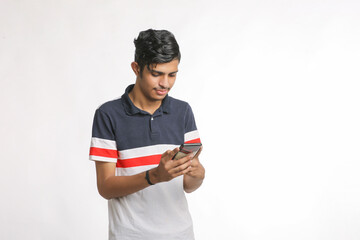 young man using smartphone on white background.