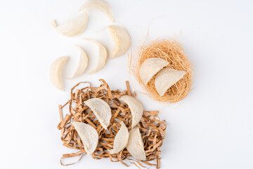 Top Grade edible bird nest shoot on white background with negative space. Raw edible bird's nest materials for tradition chinese medicine. Swallow nest the traditional chinese delicacy.