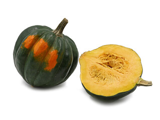raw green acorn squash, whole pumpkin and halved on white background
