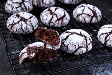Chocolate crinkle cookies with icing. Homemade chocolate christmas crinkle cookies. Selective focus. 