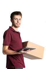 Smiling delivery man holding pile of cardboard boxes on a white background .