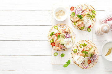 Spicy tacos with grilled salmon, vegetables, ricotta cheese, chili and fresh mint