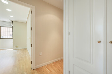 corridor in an apartment with white lacquered wood carpentry