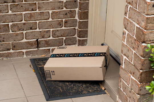 Sydney, Australia - 2021-10-30 Amazon prime box delivered to a front door of residential building