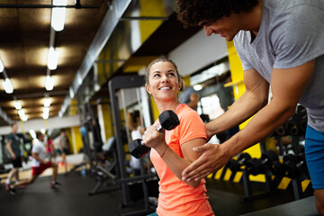 Portrait of happy fit women working out is gym to stay healthy. Sport people concept