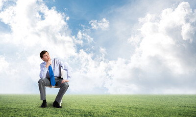 Young businessman sitting on an office chair