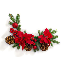 Christmas decoration. Frame of flowers of red poinsettia, branch christmas tree, red berries and...