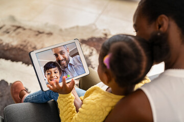 Multiethnic family doing video call using digital tablet