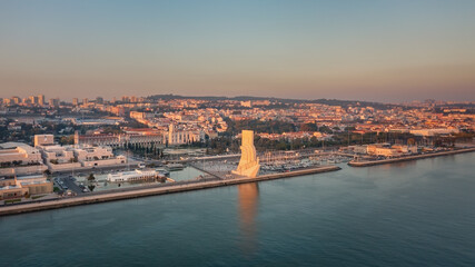 Fototapeta premium Wonderful sunset landscape overlooking the Portuguese Monument to Discoveries, Padrao dos Descobrimentos. Belem. Jeronimos Castle in background.