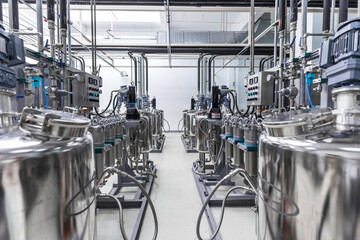 Photo of pipes and tanks. Chemistry and medicine production. Pharmaceutical factory. Interior of a...