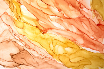 Abstract ocher watercolor background. Yellow orange brown paint stains and spots in water, luxury...