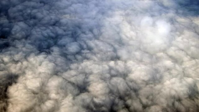 Clouds footage aerial view. Clouds taken from an international flight on the move. Fluffy clouds