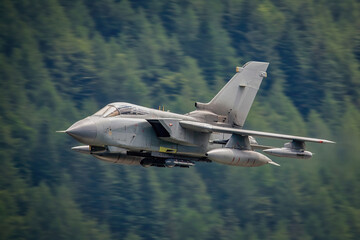 Fototapeta na wymiar jet fighter aircraft flying low level in the United Kingdom