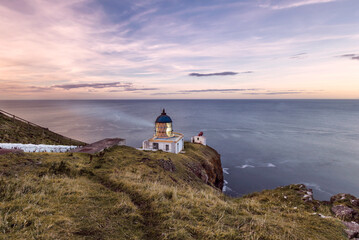 View of a lighthouse facing the North Sea in Saint Abbs, Eyemouth, Berwickshire, United Kingdom.