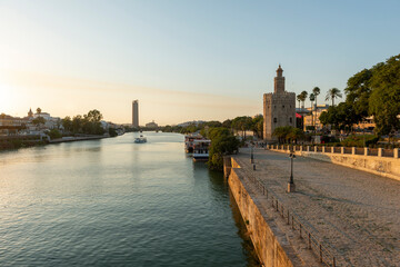 Obraz premium Seville, Spain - August 15, 2019: Guadalquivir River and Torre del Oro