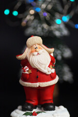 New Year's composition of Santa Claus and fir trees with lights