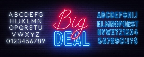 Big Deal neon sign on brick wall background