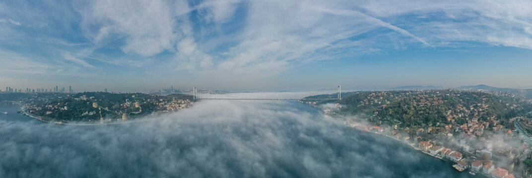 Panoramic aerial view of Istanbul skyline, view of Patih Sultan Mehmet Koprusu bridge crossing the Marmara Sea during a foggy day, Istanbul, Turkey.